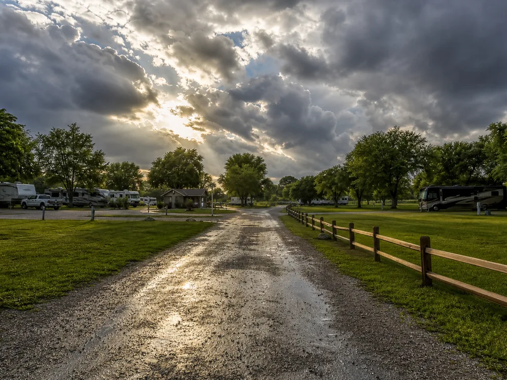 RV park access road under storm-clearing light