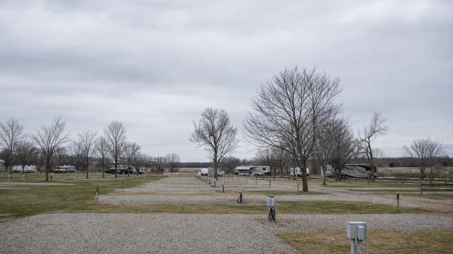 Empty off-season RV sites under flat overcast light