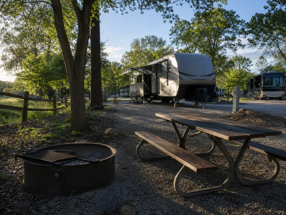 Fire ring and picnic table in late afternoon light
