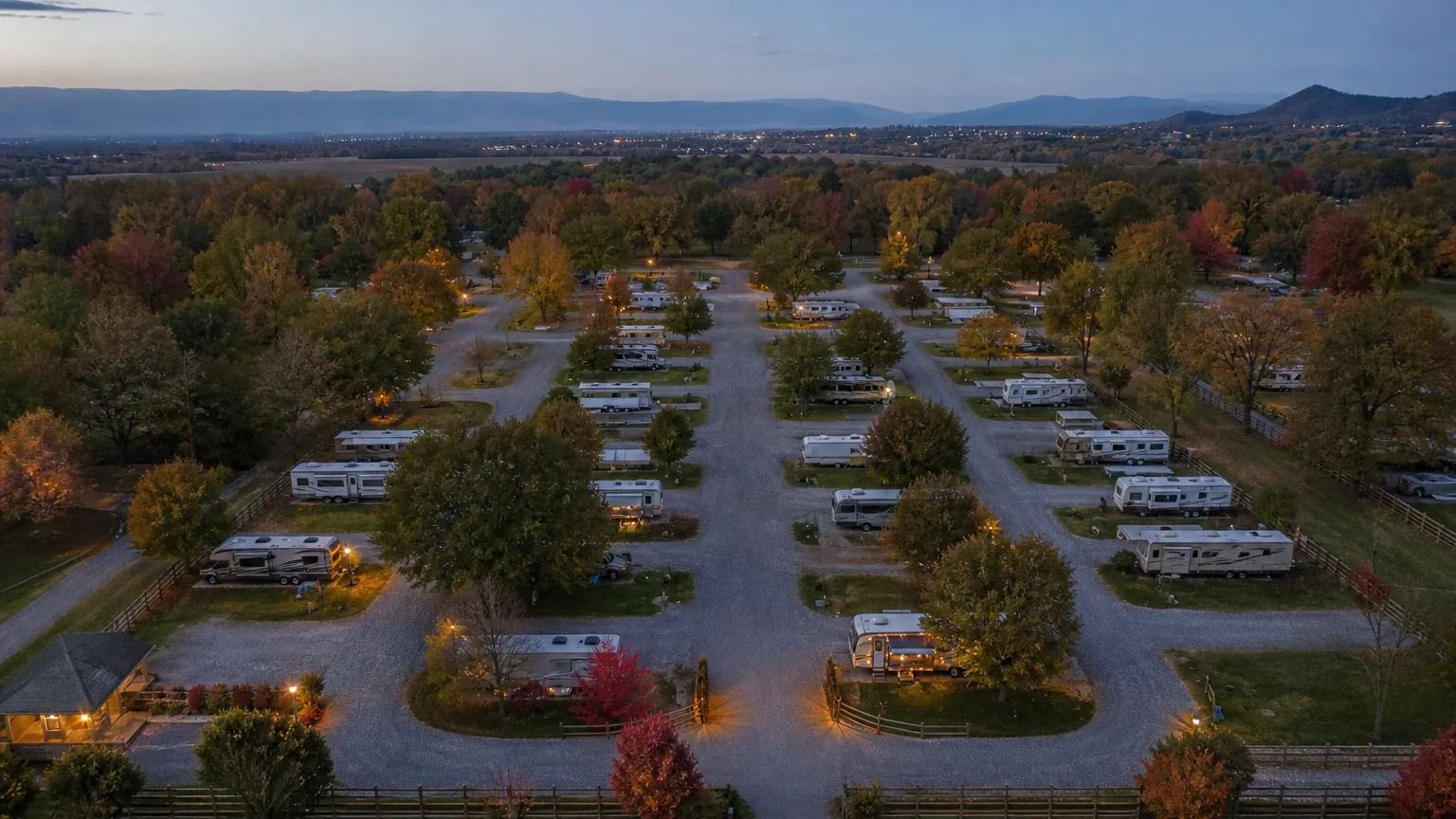 Full park layout seen from above at an RV park in blue hour dusk
