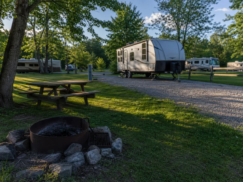 Fire ring at an RV site in late afternoon light