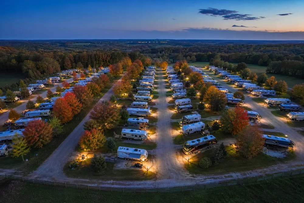 Full RV park at dusk with every gravel site occupied